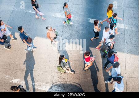 Shots of pedestrians crossing the road junction next to SM Clark Mall, Angeles City Mall, The Philippines. Stock Photo