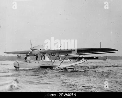 German flying boat blazes airmail route across Atlantic . Completing the first non-stop flight from the Azores , sends and Dornier flying boat ' Zephyr ' blazed the trail across the North Atlantic for the commercial airmail route . The flying boat landed at the Pan American Airways Marine base port Washington , New York , after completing the 2390 mile flight 22 hours . Photo shows , the ' Zephyr ' taxiing to the dock at the end of the flight at Washington . 18 September 1936 Stock Photo