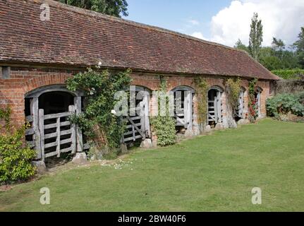 View of the outside of a renovated stable block at an English country garden. Stock Photo
