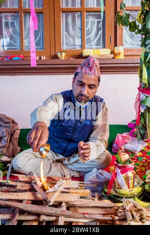 Kathmandu,Nepal - June 11,2019: Hindu Priest working in puja ceremony according to hindu rituals in kathmandu Stock Photo