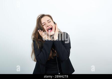 Happy, Cheerful Female Listening To Music, Headphones, Singing Along, Rejoicing Stock Photo