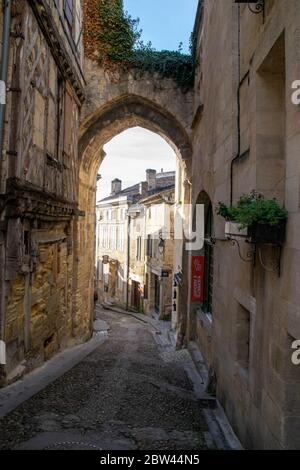 Cobbled Street through the archway in Saint Emilion Stock Photo