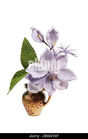 artificial flowers in a pot isolated on white background Stock Photo