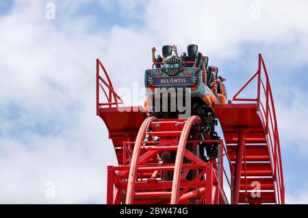 Leipzig, Germany. 29th May, 2020. Visitors ride the roller coaster 'Huracan' in the amusement park Belantis. Saxony's Minister of Tourism praised the leisure and amusement parks in the Free State for their commitment and sense of responsibility in implementing the hygiene requirements. Since 15 May, amusement parks in Saxony have also been allowed to reopen. The industry is faced with the challenge of meeting the special corona hygiene requirements and ensuring the protection of guests and employees. Credit: Jan Woitas/dpa-Zentralbild/dpa/Alamy Live News Stock Photo