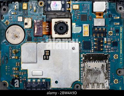 smartphone corroded blue electronic circuit mother board pattern background Stock Photo