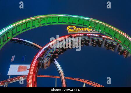 Barth's Olympia Looping, or Munich Looping at night, illuminated, largest portable steel roller coaster in the world at Winter Wonderland, Hyde Park, Stock Photo