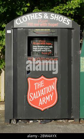 Close up of clothes bank in UK supermarket collecting unwanted clothing & shoes by The Salvation Army for Britain's homeless. Recycling UK. Stock Photo