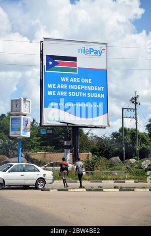 Oversized advertising poster of a mobile phone financial service provider with a temporal reference to the South Sudanese national day on one of the main streets in the South Sudanese capital of Juba, taken on 14.12.2019. The offers of such service providers are intended to make financial transactions possible for those parts of the population who otherwise have no direct access to a financial institution. Photo: Matthias Todt/dpa-Zentralbild/ZB/Picture Alliance | usage worldwide Stock Photo