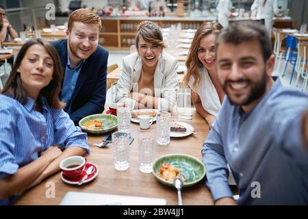Large casual business group of coworkers taking selfie on a break Stock Photo