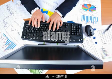 Hands of a young woman presses the keyboard. Workplace businessman Stock Photo