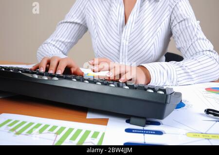 Hands of a young woman presses the keyboard. Workplace businessman Stock Photo