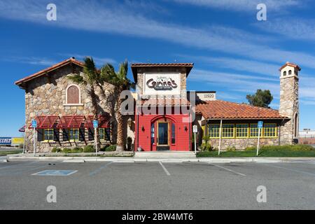 Victorville, CA / USA – February 11, 2020: Johnny Carino’s Italian restaurant exterior building located in Victorville, California, adjacent to Inters Stock Photo