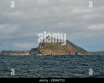 Dark clouds over Cape of Good Hope, South Africa, view from the deck of a luxury ocean cruiser. Stock Photo