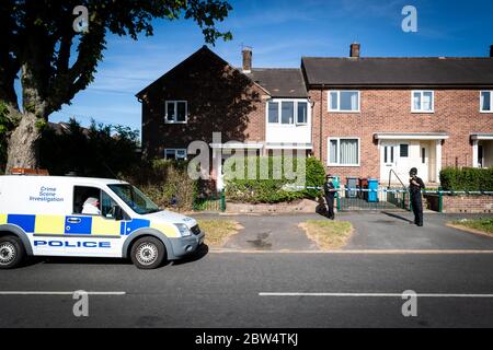 Manchester, UK. 29th May, 2020. Forensic officer and police outside the crime scene on Greenwood Road. Credit: Andy Barton/Alamy Live News Stock Photo