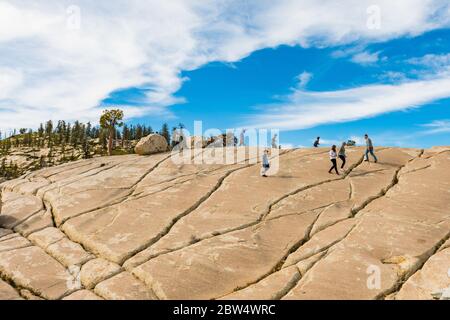 A group of tourists on the Olmsted Point granite hills in Yosemite National Park, California, USA Stock Photo
