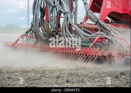 Close up huge agriculture machine at field Stock Photo