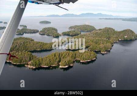 Aerial view of a cluster of forested islands at low tide at the mouth of Rivers Inlet, Great Bear Rainforest, central coast, British Columbia, Canada. Stock Photo