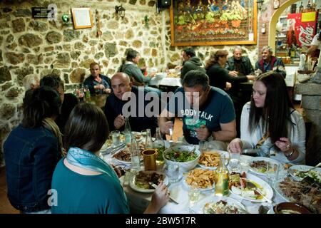 A Group Of Greek Friends Eating Dinner At A Local Village Restaurant In The Town Of Profitis Ilias On The Island Of Samothraki Thrace Greece 2bw517r 
