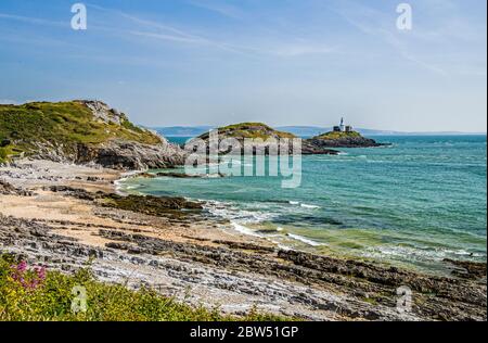 Bracelet Bay on a sunny Spring day in May. Bracelet Bay is in the south of the Gower Peninsula near Swansea, south Wales. The lighthouse is the Mumble Stock Photo