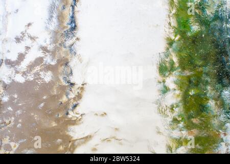 A white, beige,green colored glass pane Stock Photo