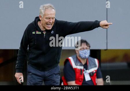 Freiburg Im Breisgau, Germany. 29th May, 2020. Football: Bundesliga, SC Freiburg - Bayer Leverkusen, 29th matchday at the Black Forest Stadium. Freiburg's coach Christian Streich reacts. Credit: Ronald Wittek/epa/Pool/dpa - IMPORTANT NOTE: In accordance with the regulations of the DFL Deutsche Fußball Liga and the DFB Deutscher Fußball-Bund, it is prohibited to exploit or have exploited in the stadium and/or from the game taken photographs in the form of sequence images and/or video-like photo series./dpa/Alamy Live News Stock Photo