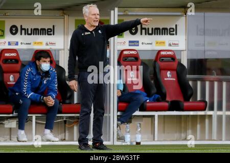 Freiburg Im Breisgau, Germany. 29th May, 2020. Football: Bundesliga, SC Freiburg - Bayer Leverkusen, 29th matchday at the Black Forest Stadium. Freiburg's coach Christian Streich reacts. Credit: Ronald Wittek/epa/Pool/dpa - IMPORTANT NOTE: In accordance with the regulations of the DFL Deutsche Fußball Liga and the DFB Deutscher Fußball-Bund, it is prohibited to exploit or have exploited in the stadium and/or from the game taken photographs in the form of sequence images and/or video-like photo series./dpa/Alamy Live News Stock Photo