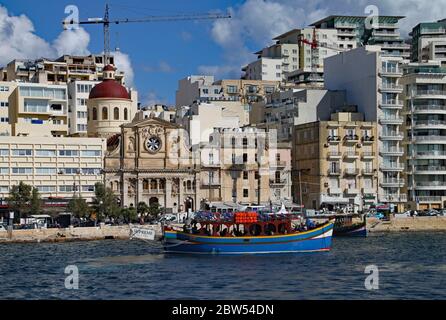 VALLETTA, MALTA - NOVEMBER 10TH 2019: Harbour cruise vessel about to set sail from Sliema on a round the island of Malta trip. Stock Photo