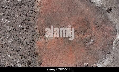 A top down view of an old worn out concrete roof tile Stock Photo