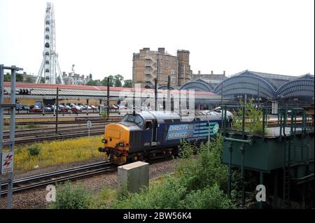 37423 'Spirit of the Lakes' passes through York Station with a ballast train. Seen from the viewing gallery at the N.R.M. Stock Photo