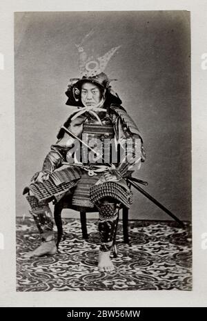 Vintage 19th century photograph - early  photographic portrait from Japan, probably the work of the Japanese photographer Shimooka Renjo - samurai in armour Stock Photo