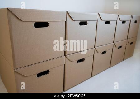 Cardboard boxes are stored in the warehouse. Stock Photo