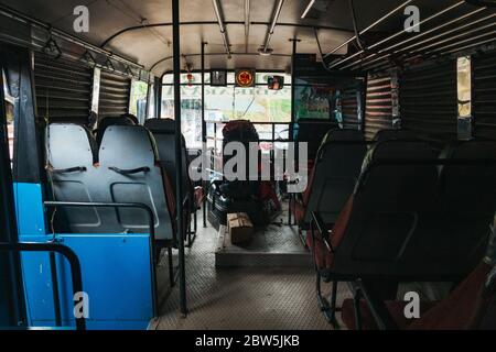 Aboard one of the infamous rolling shutter buses of Munnar. They have no glass windows, just shutters that roll down when it rains Stock Photo