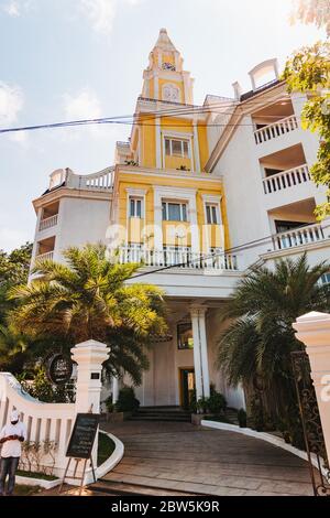 Fragrant Nature Kochi, an upscale hotel occupying a former East India Company office building with a clock tower in Kochi, India Stock Photo