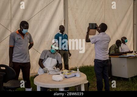 Elegu, Uganda. 28th May, 2020. Truck drivers are photographed and their details are logged at the Elegu border point between Uganda and South Sudan.Uganda closed its borders in March to everyone except cargo planes and truck drivers. Credit: SOPA Images Limited/Alamy Live News Stock Photo