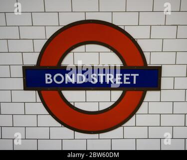 Logo London Underground and Bond Street Station Stock Photo - Alamy