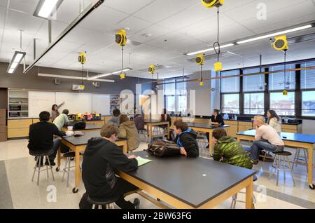 Photo of science class with students and teacher. Stock Photo