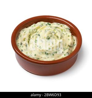Bowl with fresh made herb butter close up isolated on white background Stock Photo