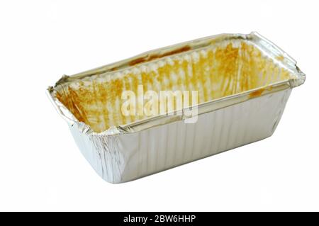 stain of butter cake in empty aluminum tray on white background Stock Photo