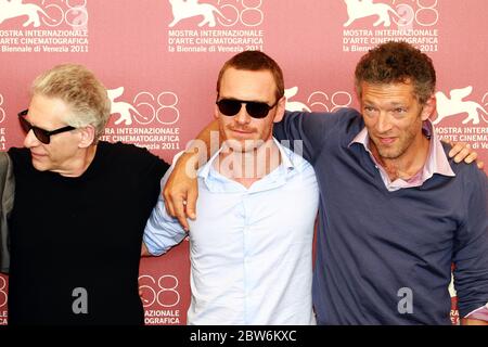 VENICE, ITALY - SEPTEMBER 02:  David Cronenberg, Michael Fassbender and Vincent Cassel poses at the 'A Dangerous Method' photocall Stock Photo