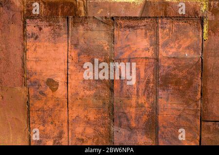 rusted tin sheets patchwork wall texture and flat background Stock Photo