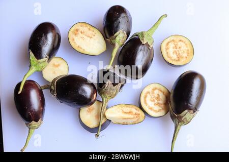 Fresh Raw Sliced Purple Eggplant Brinjal or Eggplant isolated on white background Stock Photo