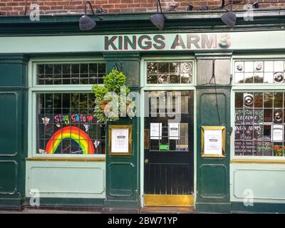 London, United Kingdom - May 08, 2020: Colourful rainbow as sign of gratitude to NHS and key workers displayed on Kings Arm pub in Greenwich. Bars & r Stock Photo
