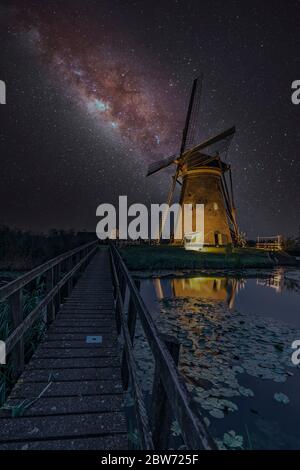 Milky way on the windmill servicing its duty under a warm cloudless and warm weather at Kinderdijk, Netherlands Stock Photo