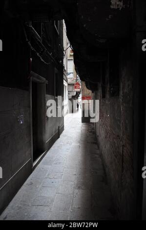 Narrow dimly side alley in Venice, Italy (far away from mass tourism) Stock Photo