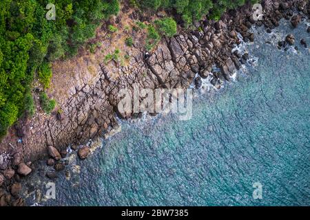 Aerial view of sea waves and fantastic rocky coast at Mong Tay island in Phu Quoc island, Kien Giang, Vietnam Stock Photo