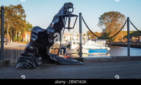 KLAIPEDA, LITHUANIA - 15 OCTOBER 2019: Juodasis Vaiduoklis (The Black Ghost) bronze sculpture (designed by Svajunas Jurkus and Sergejus Plotnikovas). Stock Photo