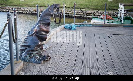 KLAIPEDA, LITHUANIA - 15 OCTOBER 2019: Juodasis Vaiduoklis (The Black Ghost) bronze sculpture (designed by Svajunas Jurkus and Sergejus Plotnikovas). Stock Photo