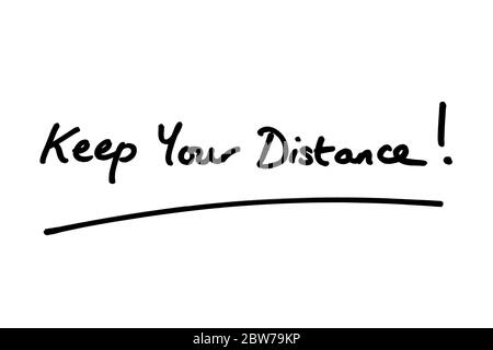 Keep Your Distance! handwritten on a white background. Stock Photo