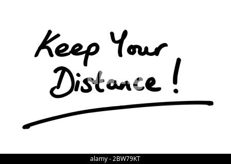 Keep Your Distance! handwritten on a white background. Stock Photo