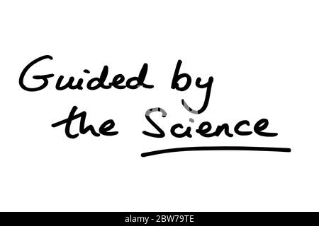 Guided by the Science handwritten on a white background. Stock Photo
